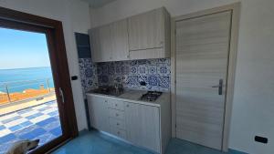 Η κουζίνα ή μικρή κουζίνα στο La Casetta Palinuro Sole +1 φωτογραφίες