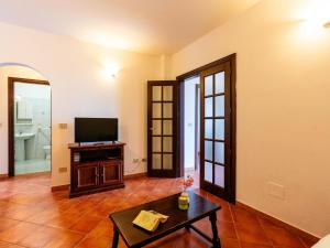 A television and/or entertainment centre at Apartment La Colombera-2 by Interhome