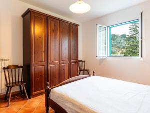 A bed or beds in a room at Apartment La Colombera-2 by Interhome
