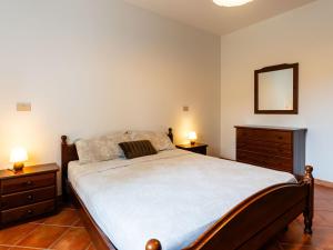 A bed or beds in a room at Apartment La Colombera-2 by Interhome