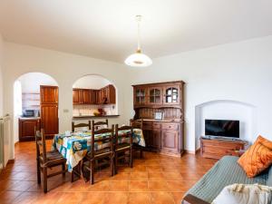 a kitchen and dining room with a table and chairs at Apartment La Colombera-3 by Interhome in Diano Castello +18 photos