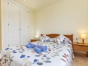 A bed or beds in a room at Apartment Port Pals EIII by Interhome