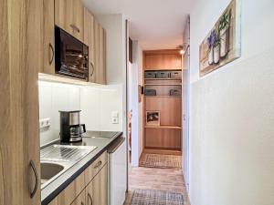 Kuchyň nebo kuchyňský kout v ubytování Apartment Bergliebe - G 103 by Interhome