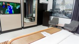 Televisyen dan/atau pusat hiburan di GreenPoint Hotel