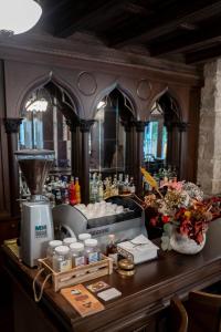 a counter with a blender and other items on it at Hotel Boutique Vila 8 in Durrës