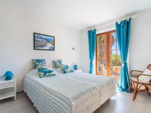 Łóżko lub łóżka w pokoju w obiekcie Villa Villa Etoile Filante by Interhome