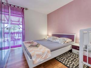 Postel nebo postele na pokoji v ubytování Holiday Home Radmila by Interhome