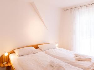 Ένα ή περισσότερα κρεβάτια σε δωμάτιο στο Apartment Sonnenküste by Interhome