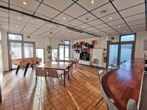 a room with tables and chairs and a pool table at Auberge de Jeunesse HI Boulogne-sur-Mer in Boulogne-sur-Mer +8 photos