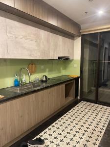 a kitchen with a sink and a counter at Happy Home in Ha Long