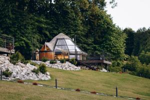 a house on top of a hill with rocks at Osada Poli Koniaków - Panoramiczny Domek nr 5 z Prywatną Balią i Hydromasażem in Koniaków +14 photos