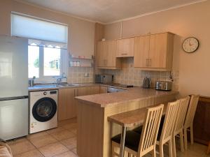 a kitchen with a counter and a dishwasher at 3BR House By Cozy Quarters Property Management Contractors Accommodation Trimdon Grange With Easy access to A1 in Trimdon Grange