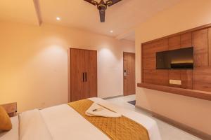 Hotel Beverly Palace Kozhikode - Hotel and Restaurant客房内的一张或多张床位