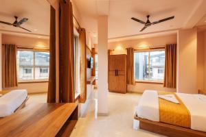 Hotel Beverly Palace Kozhikode - Hotel and Restaurant客房内的一张或多张床位