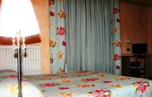 Postel nebo postele na pokoji v ubytování Albergo Sangrilà