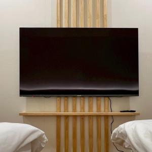 TV a/nebo společenská místnost v ubytování Yunshanjian B&B