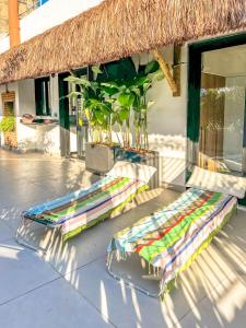 two beds sitting on a patio next to a building at Rio Bem-te-vi in Rio de Janeiro