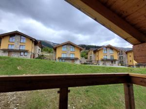 a view of a row of houses on a hill at CHALET SCALA SIX JASNÁ - FREE Jacuzzi & Sauna & Breakfast ! in Belá