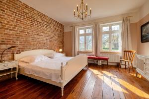 Ένα ή περισσότερα κρεβάτια σε δωμάτιο στο Landhaus Wusse Ferienwohnung Stralsund