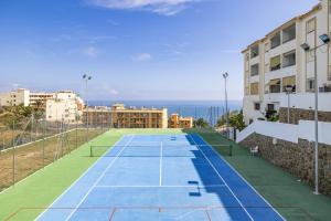 an image of a tennis court on a building at Carvajal Beach Holiday Apartment in Benalmádena