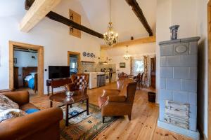 a living room with a couch and a table at Landhaus Möhlend in Waase