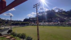 a pole with lights on top of a field at Casa HM in Delfim Moreira