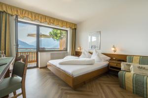 Posteľ alebo postele v izbe v ubytovaní Hotel Garni Nachtigall