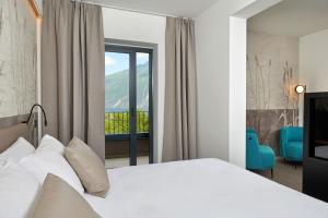 Postel nebo postele na pokoji v ubytování Hotel Royal Village