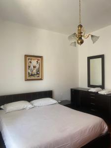 Кровать или кровати в номере Villa Marisa Villa unifamiliare con giardino