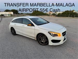 a white car parked in a parking lot at Marbella Deluxe Rooms in Royal Cabopino Townhouse in Marbella