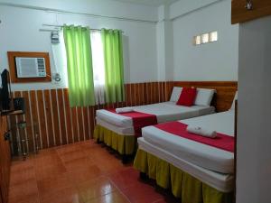 Voodi või voodid majutusasutuse Axis Pension Hotel toas