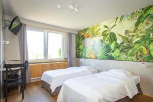 Postel nebo postele na pokoji v ubytování Thermae Grimbergen Hotel