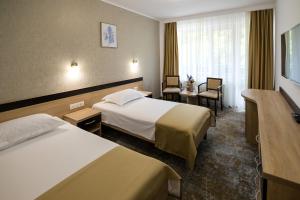 Postel nebo postele na pokoji v ubytování Complex Balnear Cozia - Corp Caciulata