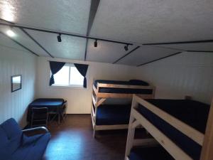 a room with two bunk beds and a window at Godspeed Events and Lodging in Port Matilda +9 photos