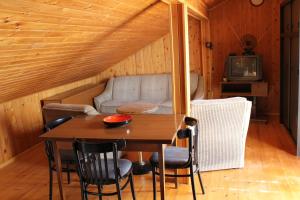 a living room with a table and a couch at Apartments Paula in Splitska