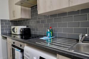 a kitchen with a sink and a counter top at Gosford Park Studio 4 - Coventry in Coventry