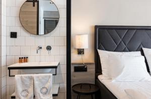 Postel nebo postele na pokoji v ubytování Langley Hôtel Tignes 2100