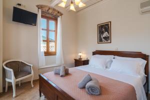 Postel nebo postele na pokoji v ubytování Authentic Suites in Fiscardo (Archontiko)