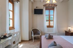 Postel nebo postele na pokoji v ubytování Authentic Suites in Fiscardo (Archontiko)