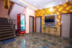 a lobby with a vending machine and stairs at Hotel Ayodhya Palace - 400 Mtrs from HANUMAN GARHI in Ayodhya