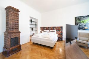 Postel nebo postele na pokoji v ubytování GH Luxury Apartments Graz, Gösser Haus