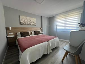 Postel nebo postele na pokoji v ubytování Apartamento da Fraga + 4 fotografie
