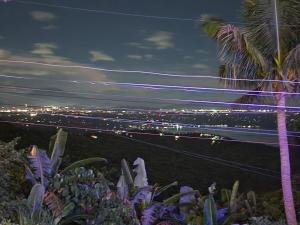 a city at night with palm trees and lights at Tagaytay Starcation in Tagaytay