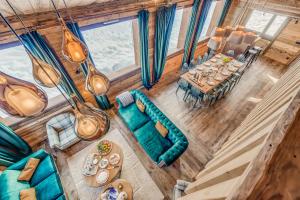 an overhead view of a living room and dining room at Chalet RIVA ski in-out Plagne Village in La Plagne Tarentaise