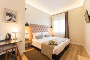 Posteľ alebo postele v izbe v ubytovaní Hotel Real Segovia by Recordis Hotels