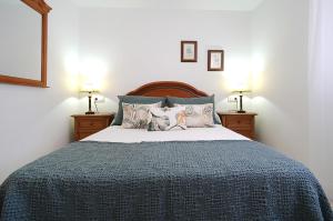 En eller flere senge i et værelse på Apartamento cerca del Paseo Marítimo de O Grove