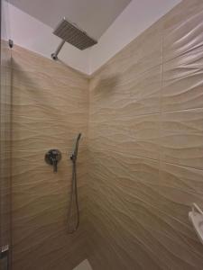 a shower with a glass door in a bathroom at Dimora Chiarina in Mola di Bari +23 photos