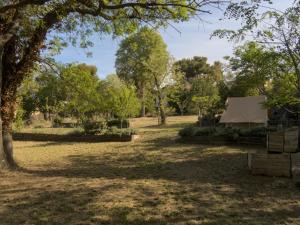 a field with a tent in the middle of a park at Auberge de Jeunesse HI Marseille Bois-Luzy in Marseille