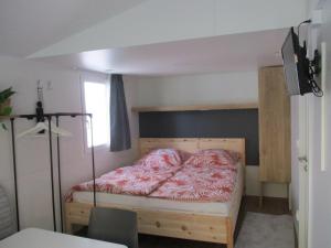Postel nebo postele na pokoji v ubytování Tinyhaus Leo