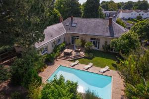 an aerial view of a house with a swimming pool at Villa de La Plume in Nantes